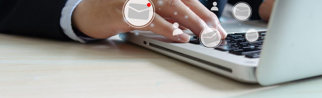 businessman hand typing on laptop keyboard checking email online. business technology on a virtual interface