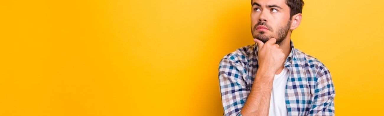 Close,Up,Portrait,Of,Thoughtful,Man,Who,Looks,Away,Touching