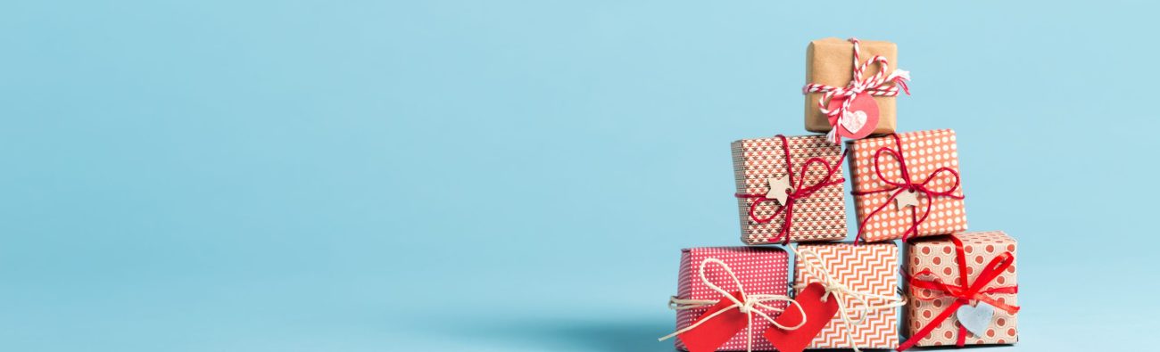 Collection,Of,Christmas,Present,Boxes,On,A,Light,Blue,Background