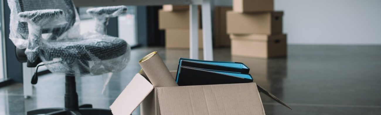 Cardboard,Box,With,Folders,And,Office,Supplies,In,Floor,During