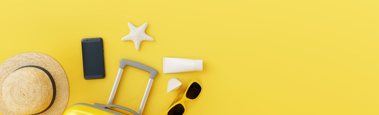 Flat,Lay,Yellow,Suitcase,With,Traveler,Accessories,On,Yellow,Background.