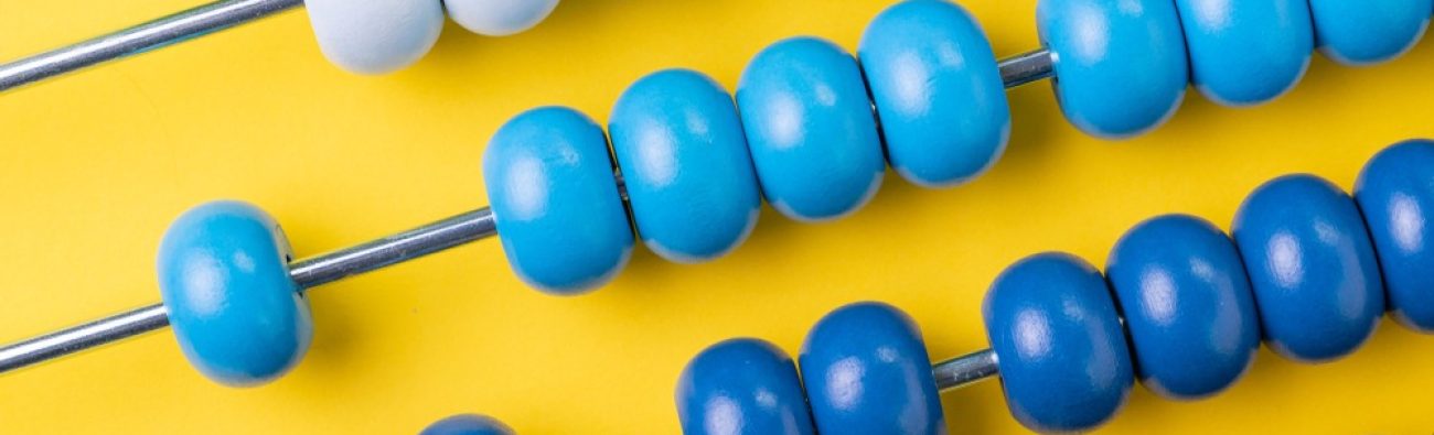Colorful,Wooden,Abacus,Beads,On,Yellow,Background,,Business,Financial,Or