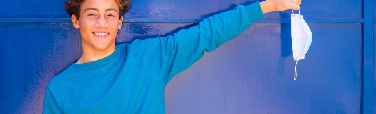 One,Happy,Young,Teenager,With,A,Blue,Background,And,Wearing